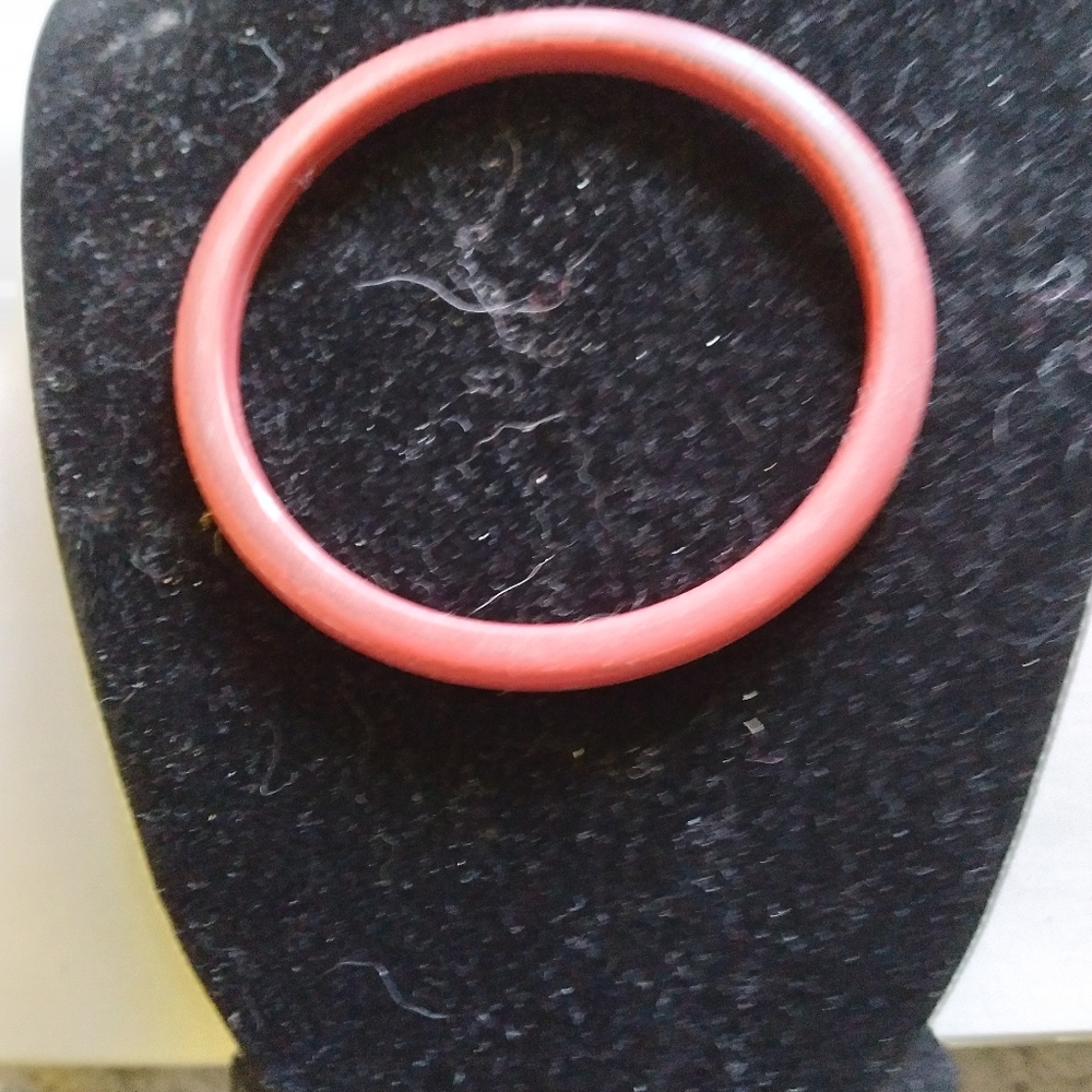 Coral color bracelet.